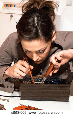 Young woman with fuse-box View Large Photo Image Stock Photograph - Young woman with fuse-box. Fotosearch