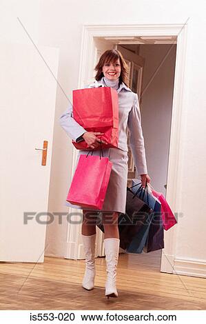 Young woman with shopping View Large Photo Image Stock Image - Young woman with shopping. Fotosearch