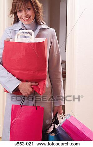 Young woman with shopping View Large Photo Image Stock Image - Young woman with shopping. Fotosearch