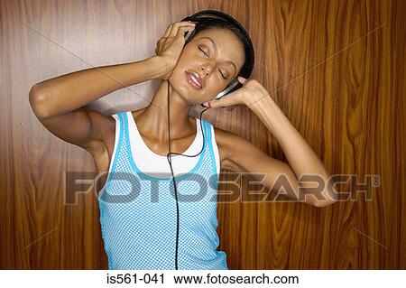 Asian woman wearing headphones View Large Photo Image Stock Image - Asian woman wearing headphones. Fotosearch