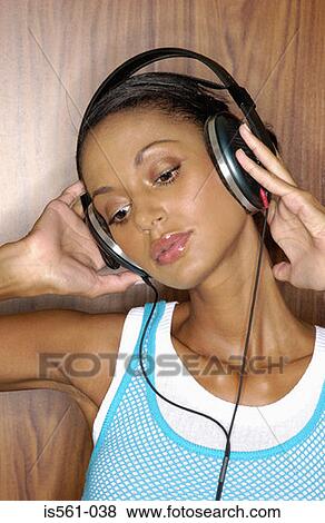 Asian woman wearing headphones View Large Photo Image Stock Photo - Asian woman wearing headphones. Fotosearch