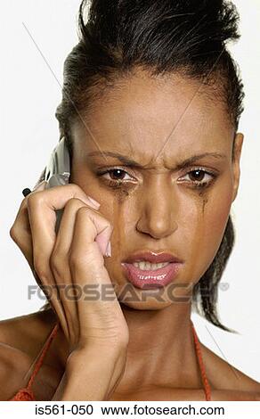 Crying woman using cellular telephone View Large Photo Image Stock Image - Crying woman using cellular telephone. Fotosearch