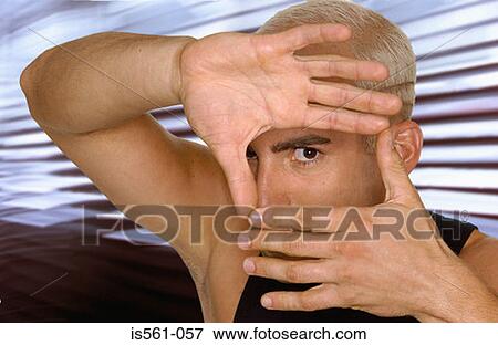 Man looking through fingers View Large Photo Image Stock Photo - Man looking through fingers. Fotosearch