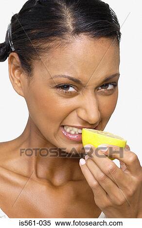 Woman smelling a lemon View Large Photo Image Stock Photography - Woman smelling a lemon. Fotosearch