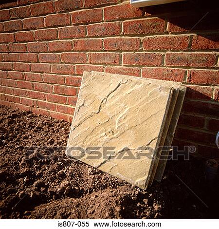 Slabs leaning against a brick wall View Large Photo Image Stock Photography - Slabs leaning against a brick wall. Fotosearch