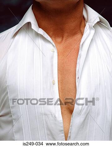 Picture - Man wearing very tight shirt. Fotosearch