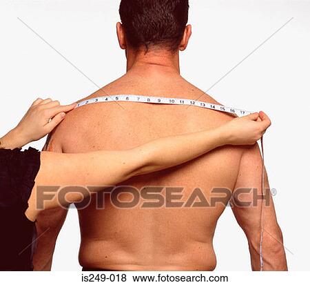 Stock Photo - Measuring across male back. Fotosearch