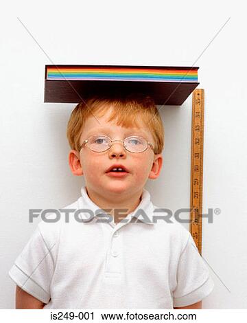 Measuring height of young boy View Large Photo Image Stock Image - Measuring height of young boy. Fotosearch