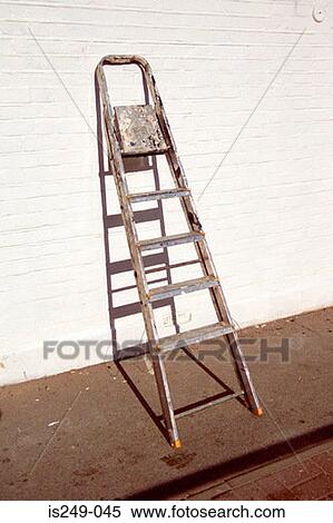 Stock Photography - Stepladder leaning against wall. Fotosearch