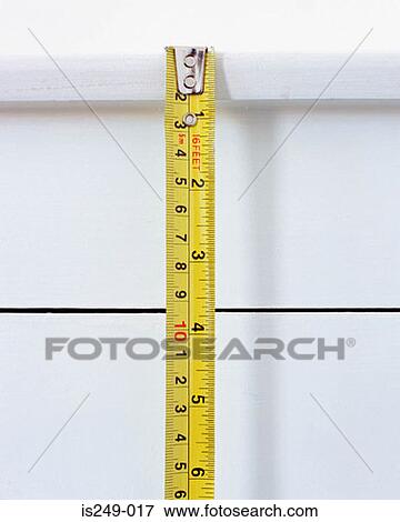 Tape measure being used View Large Photo Image Stock Photo - Tape measure being used. Fotosearch