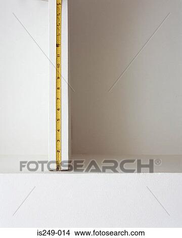 Tape measure on shelf space View Large Photo Image Picture - Tape measure on shelf space. Fotosearch
