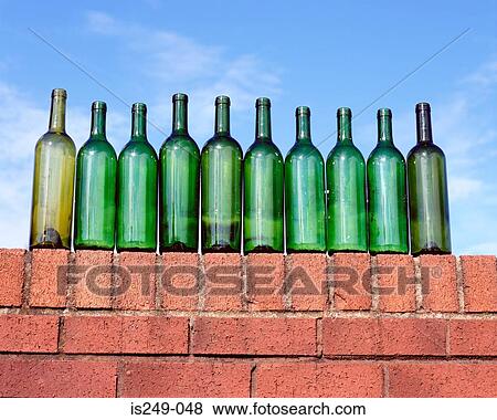 Ten green bottles on brick wall View Large Photo Image Stock Photo - Ten green bottles on brick wall. Fotosearch