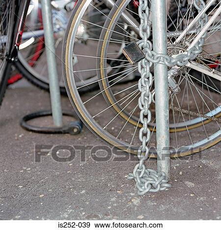 Chained up bicycles View Large Photo Image Stock Photo - Chained up bicycles. Fotosearch