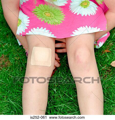 Girl with plaster on her knee View Large Photo Image Stock Image - Girl with plaster on her knee. Fotosearch