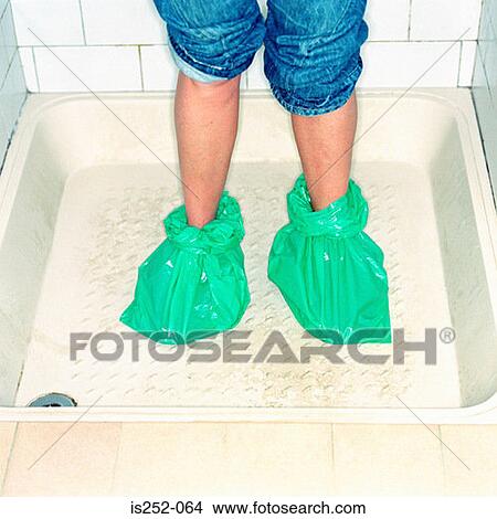 Keeping the feet dry View Large Photo Image Picture - Keeping the feet dry. Fotosearch