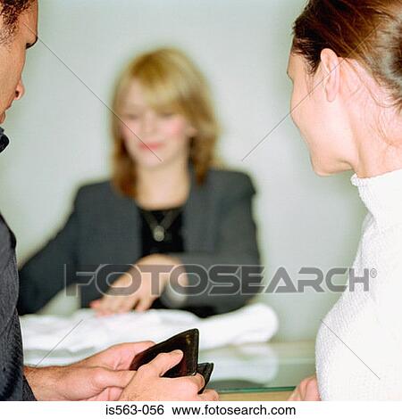 Stock Photograph - Couple at store counter. Fotosearch