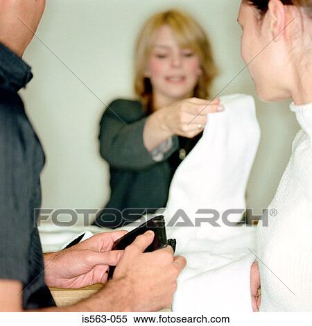 Couple at store counter View Large Photo Image Stock Photography - Couple at store counter. Fotosearch