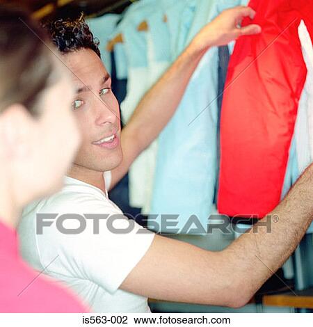 Couple in clothing store View Large Photo Image Stock Image - Couple in clothing store. Fotosearch