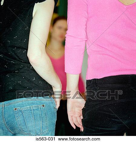 Girls in store fitting room View Large Photo Image Stock Image - Girls in store fitting room. Fotosearch