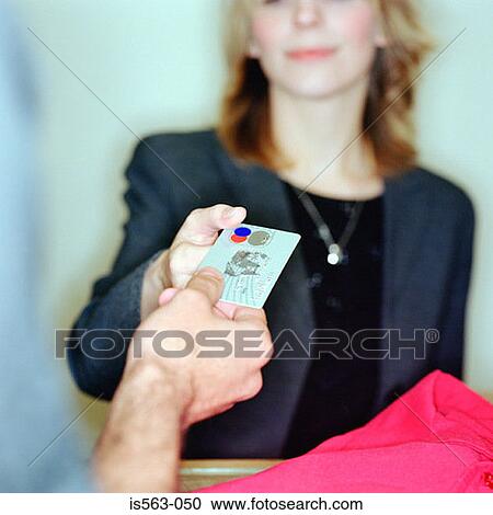 Man buying clothes with credit card View Large Photo Image Stock Image - Man buying clothes with credit card. Fotosearch
