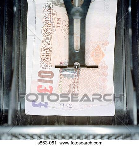 Stock Image - Ten pounds in cash register. Fotosearch