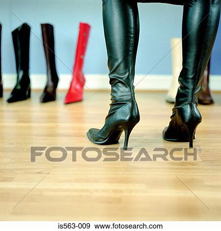 Woman wearing knee boots View Large Photo Image Stock Photo - Woman wearing knee boots. Fotosearch