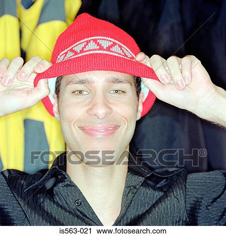 Young man wearing a knit hat View Large Photo Image Stock Image - Young man wearing a knit hat. Fotosearch