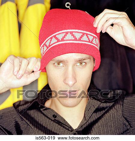 Young man wearing a knit hat View Large Photo Image Stock Photo - Young man wearing a knit hat. Fotosearch