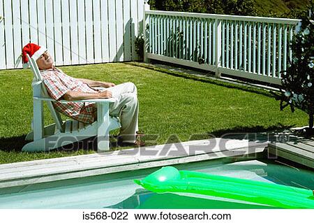 Having a kip by the pool View Large Photo Image Stock Image - Having a kip by the pool. Fotosearch