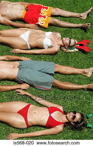 Stock Image - Sunbathing in Xmas head decoration . Fotosearch