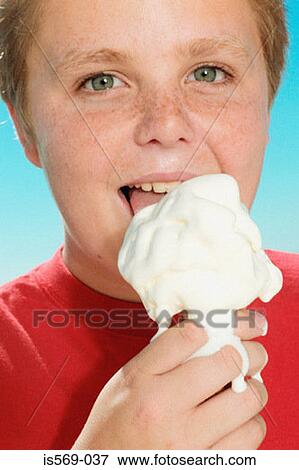 Boy enjoying a big ice cream View Large Photo Image Stock Photo - Boy enjoying a big ice cream. Fotosearch