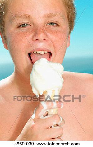 Stock Photo - Boy enjoying a big ice cream. Fotosearch