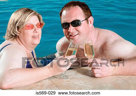 Couple enjoying themselves View Large Photo Image Stock Photo - Couple enjoying themselves. Fotosearch