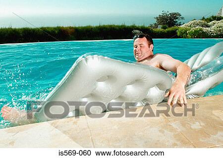 Man falling off lilo View Large Photo Image Stock Image - Man falling off lilo. Fotosearch