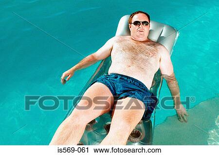 Man on lilo View Large Photo Image Stock Image - Man on lilo. Fotosearch
