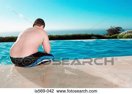 Overweight boy having a break from swimming View Large Photo Image Stock Image - Overweight boy having a break from swimming. Fotosearch