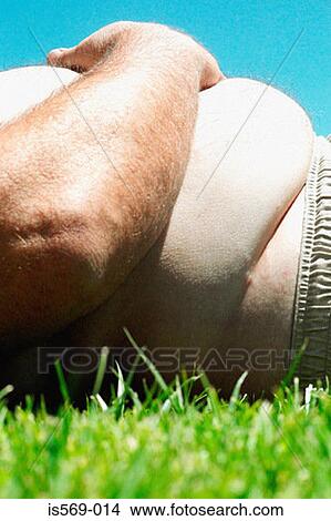 Overweight man sunbathing View Large Photo Image Picture - Overweight man sunbathing. Fotosearch