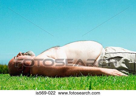 Overweight man sunbathing View Large Photo Image Stock Image - Overweight man sunbathing. Fotosearch
