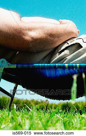 Overweight man sunbathing View Large Photo Image Stock Photography - Overweight man sunbathing. Fotosearch