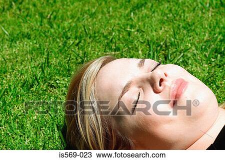 Woman sunbathing View Large Photo Image Stock Image - Woman sunbathing. Fotosearch