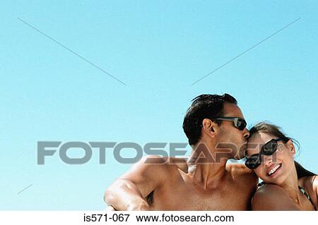 Stock Photo - Couple kissing. Fotosearch