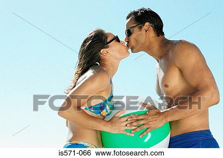 Couple kissing View Large Photo Image Stock Photograph - Couple kissing. Fotosearch