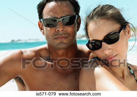 Couple sitting on beach View Large Photo Image Stock Photo - Couple sitting on beach. Fotosearch