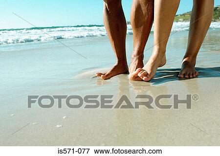 Couple walking on beach View Large Photo Image Stock Photo - Couple walking on beach. Fotosearch