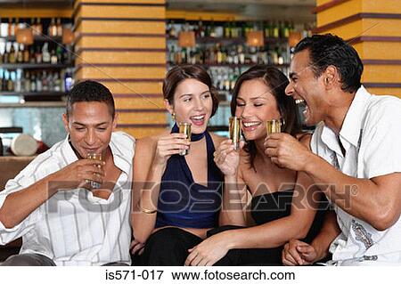 Friends drinking in bar View Large Photo Image Stock Photo - Friends drinking in bar. Fotosearch