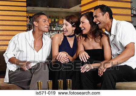 Friends drinking in bar View Large Photo Image Stock Photo - Friends drinking in bar. Fotosearch