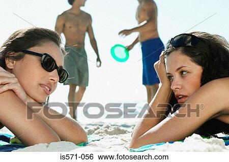 People resting on beach View Large Photo Image Stock Photograph - People resting on beach. Fotosearch