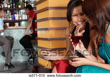 Stock Photography - People sitting in bar. Fotosearch