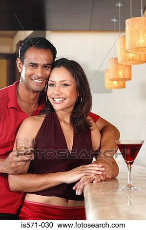 Smiling couple in bar View Large Photo Image Stock Image - Smiling couple in bar. Fotosearch