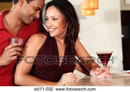 Smiling couple in bar View Large Photo Image Stock Image - Smiling couple in bar. Fotosearch